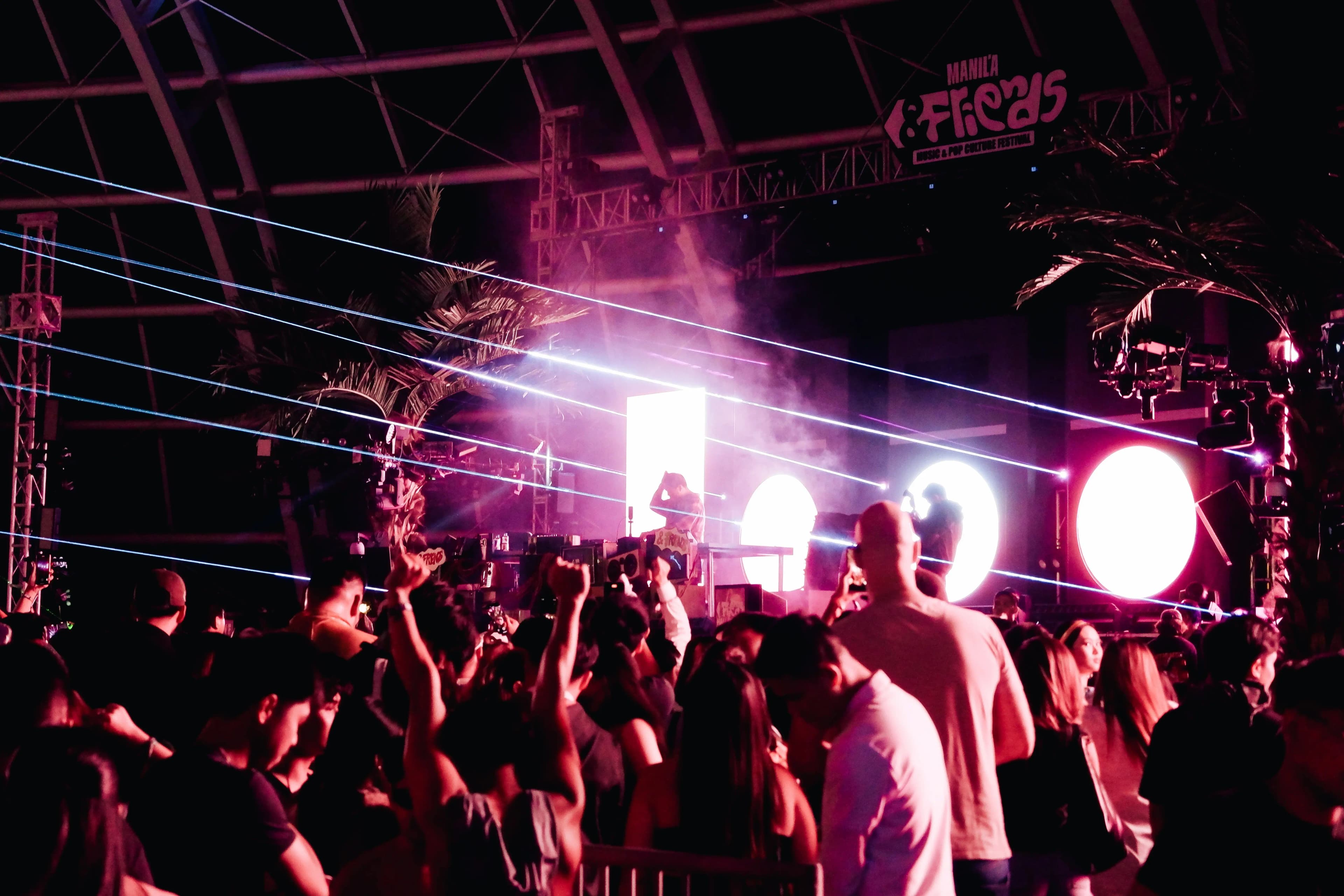 Outdoor festival crowd and stages suggesting live music festival atmosphere
